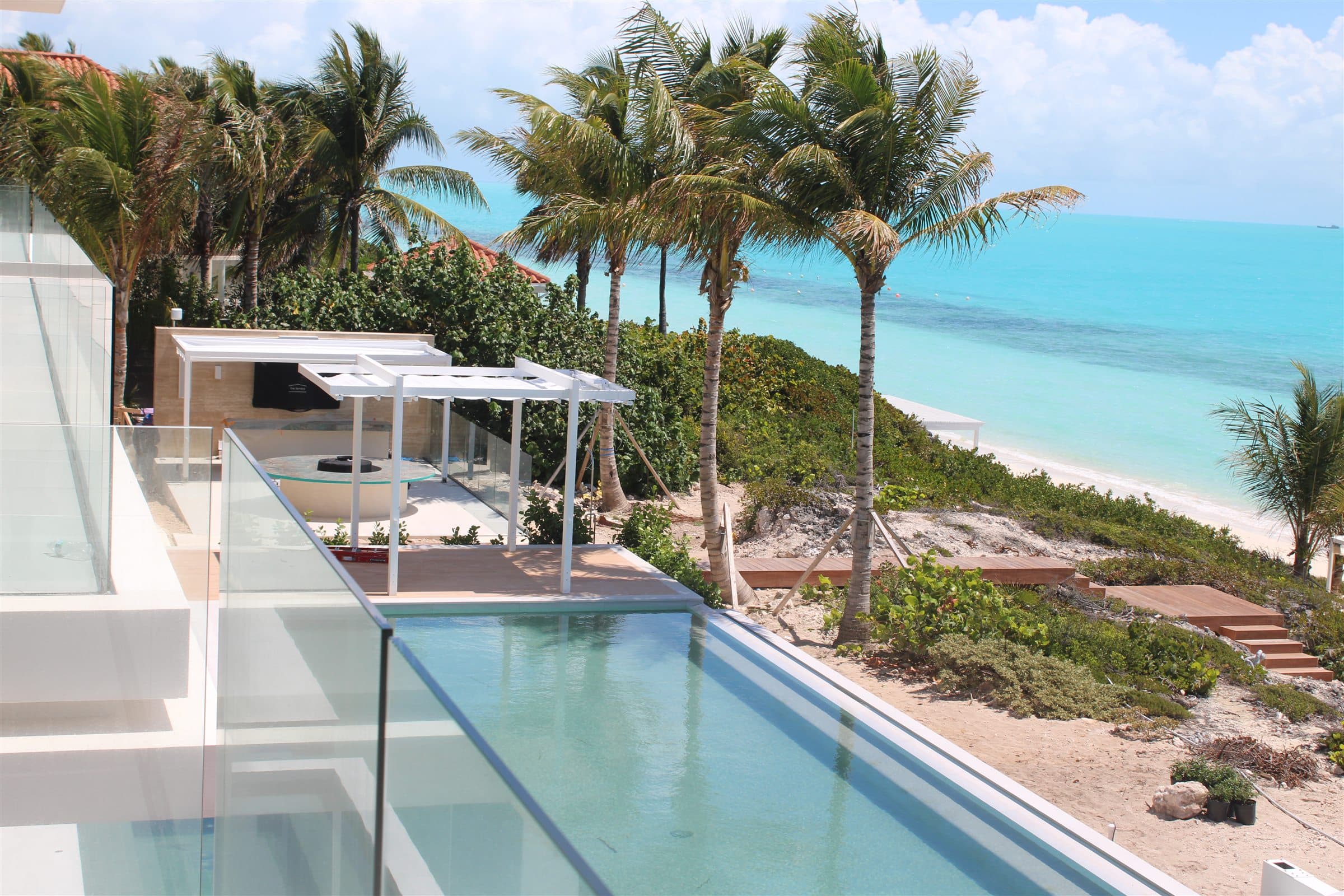 Paradisa Villa pool terrace overlooking the ocean in Long Bay, Providenciales